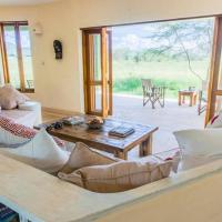 The Chui Cottage in the wild, Maasai Mara by YourHost, hotel in Aitong