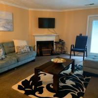 a living room with a couch and a table at Cozy2BrVilla in StoneCrest-NearStone MTN Park, Lithonia
