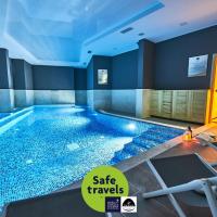 a large swimming pool in a hotel room at Perla Residence Hotel & SPA, Podgorica