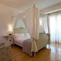 a bedroom with a canopy bed and a window at Hotel Villa Poseidon & Events, Salerno
