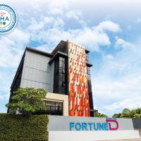 a building with a for future sign in front of it at Fortune D Hotel Phitsanulok