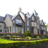 a large house with a garden in front of it at Falls of Lora Hotel, Oban