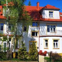 a large white house with a red roof at Parkowa Rezydencja Hubal, Rabka-Zdr&oacute;j