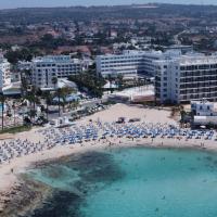 an aerial view of a beach with people and umbrellas at Anonymous Beach Hotel (Adults 16+), Ayia Napa