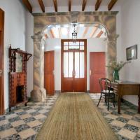 a hallway with a room with a bed and a desk at Casal de Petra - Rooms & Pool by My Rooms Hotels
