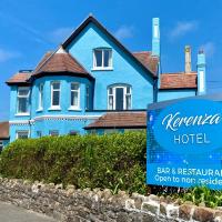 a blue house with a sign in front of it at Kerenza Hotel Cornwall, Bude