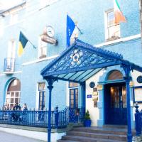 a blue building with a blue arch in front of it at Club House Hotel Kilkenny
