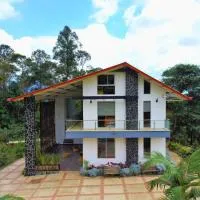 Finca Turistica Buenos Aires Casa Balmoral، فندق في Tena
