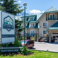a sign in front of a building with a residence at Pocaterra Inn & Waterslide, Canmore