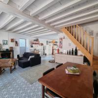 a living room with a couch and a table at Maison avec terrasse au coeur de Sancerre