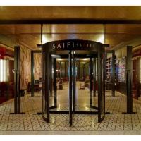 a lobby of a building with a revolving door at Saifi Suites, Beirut