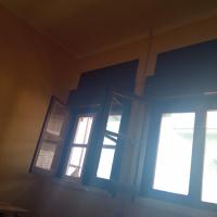 three windows in a room with blue walls at SaldomarBissau flat