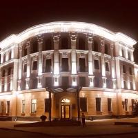 a large building lit up at night at Hotel Byg, Brest