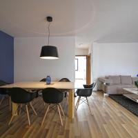 Blue apartment over Prizren roofs