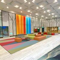 a lobby with colorful furniture and large windows at Uni-Resort Ku-Kuan, Heping