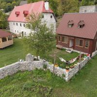 an aerial view of a house and a stone wall at Bujtina Terthorja, Theth