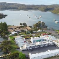 an aerial view of a lake with boats in the water at Batemans Bay Lodge