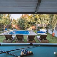 a pool table in a backyard with a swimming pool at Villa Hermes, Potamós