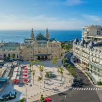 an aerial view of a city with buildings and the ocean at Hôtel de Paris Monte-Carlo, Monte Carlo