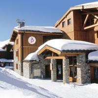 a ski lodge with snow on the roofs at Belambra Clubs Résidence Les Menuires - Le Hameau Des Airelles