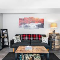 a living room with a couch and a table at LightHouse Cove #208, Wisconsin Dells