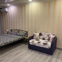 a room with two beds and a couch in it at 020 Новые апартаменты ЖК «Софиевская Слободка», Vyshneve