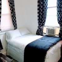 a small bedroom with a bed and a window at Cozy Apartment Easy Transportation 2 New York City, West New York