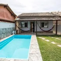 Tamoios में, होटल Casa com piscina, wifi e churrasqueira em unamar.