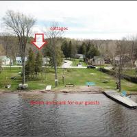 Family Relaxation Place for 2-15 People - 4 Lakeview Cottages with Real Sandy Swimming Beach, Dock, Boats, Firepits, Recreation Room, hotel in Fenelon Falls