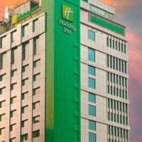 a building with a sign on the side of it at Holiday Inn Dhaka City Centre, an IHG Hotel