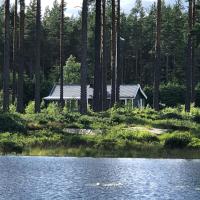 Modern lakeside cottage & boat near Isaberg