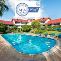 a swimming pool in front of a resort at Pen Villa Hotel, Surin Beach - SHA Extra Plus