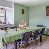 a dining room with a green table and chairs at Modern Holiday Home near Ravel Cycling paths in Saint Vith, Heuem
