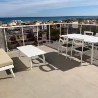 Ático con terraza y vistas al mar - Playa tranquila - Oliva، فندق في أوليفا