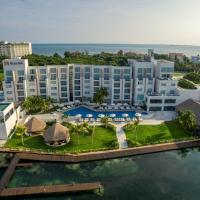 an aerial view of a resort on the water at Real Inn Cancún