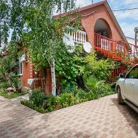 a car parked in front of a brick house at Ивушка, Lermontovo