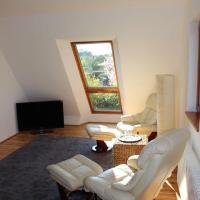 a living room with white furniture and a window at Top Appartement 1 in Rosengarten/Hamburg