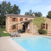 a stone house with a swimming pool in front of it at Le Mounard - Cottage 1 - 4 bedrooms and private heated swimming pool, Biron