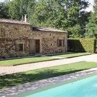 a stone house with a swimming pool in front of it at Le Mounard - Cottage 2 with 2 bedrooms and private heated swimming pool, Biron