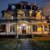 Mini Mansion Hotel near public transportation is the yellow and green house on the corner of 8th st and Madison avenue, hotel a Plainfield