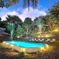 a swimming pool in a yard with lights at Banyan Bay Villas, Ko Jum
