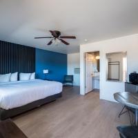 a bedroom with a bed and a ceiling fan at Balanced Rock Inn, Fruita