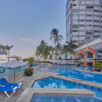 a pool at a hotel with chairs and tables at Gamma Acapulco Copacabana