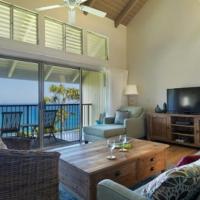a living room with a couch and a television at Pali Ke Kua 209, Princeville