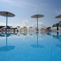 a swimming pool with umbrellas and tables and chairs at Corfu Sea Gardens Hotel, Kavos