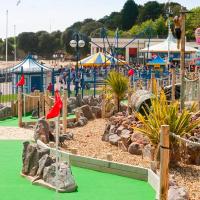 a water park with a playground with rocks and slides at LARGE FAMILY APARTMENTS - Barry Island - FREE Parking - Complimentary Tray, Super Fast Wifi, SMART TV