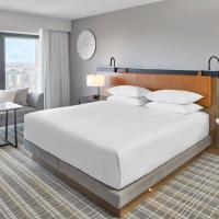a bedroom with a large white bed and a couch at Hyatt Regency Atlanta