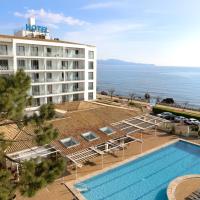 an aerial view of a hotel with a pool and the ocean at RVHotels Nieves Mar, L'Escala