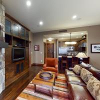 a living room with a couch and a fireplace at Northstar Lodge Luxury, Kingswood Estates