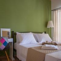 a bedroom with a bed with a desk and a chair at Stonehouse with wonderful seaview, Samos